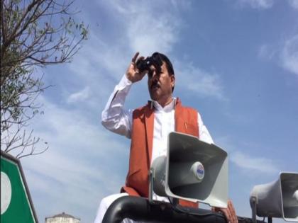 Ahead of UP polls results, SP candidate keeps eye on EVM strong room with binoculars | Ahead of UP polls results, SP candidate keeps eye on EVM strong room with binoculars
