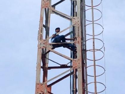 Drunk man climbs tower in Andhra's Chittoor | Drunk man climbs tower in Andhra's Chittoor