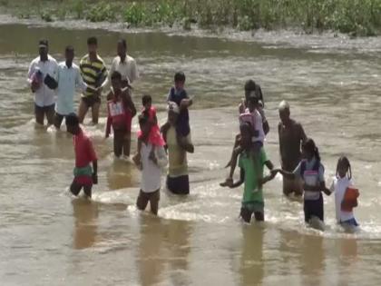 Chhattisgarh: Students wade through river to reach school, rainwater adds to woes | Chhattisgarh: Students wade through river to reach school, rainwater adds to woes
