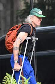 Daniel Day-Lewis looks unrecognisable as he steps out with crutches, long grey hair | Daniel Day-Lewis looks unrecognisable as he steps out with crutches, long grey hair