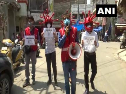Volunteers wear virus-shaped helmets to create awareness about following Covid protocols in Jammu | Volunteers wear virus-shaped helmets to create awareness about following Covid protocols in Jammu
