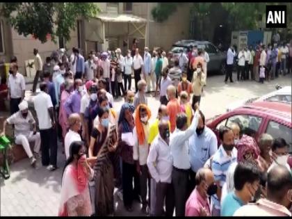 People throng Noida hospital to get COVID vaccines, flout norms | People throng Noida hospital to get COVID vaccines, flout norms