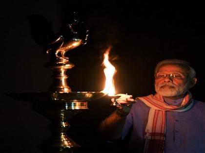 PM Modi lights lamp, joins country to mark fight against coronavirus | PM Modi lights lamp, joins country to mark fight against coronavirus PM Modi lights lamp, joins country to mark fight against coronavirus | PM Modi lights lamp, joins country to mark fight against coronavirus
