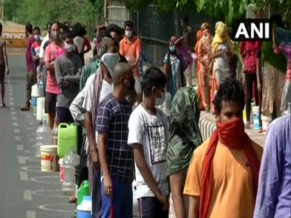 Residents of Delhi's Chilla village wait for hours to collect water from DJB tankers | Residents of Delhi's Chilla village wait for hours to collect water from DJB tankers