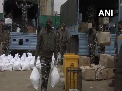 CRPF distributes food, essential commodities among people in various districts of J-K | CRPF distributes food, essential commodities among people in various districts of J-K