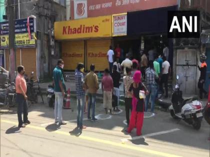 People follow social distancing norms while queuing outside liquor shops in Assam's Dibrugarh | People follow social distancing norms while queuing outside liquor shops in Assam's Dibrugarh People follow social distancing norms while queuing outside liquor shops in Assam's Dibrugarh | People follow social distancing norms while queuing outside liquor shops in Assam's Dibrugarh