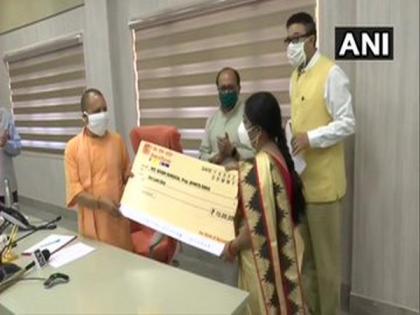 UP CM gives cheques to people involved in MSME sector as part of state's online loan fair | UP CM gives cheques to people involved in MSME sector as part of state's online loan fair