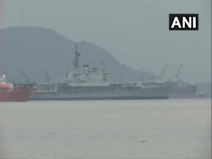 De-commissioned INS Viraat moves out of the Naval Dockyard for ship-breaking yard in Gujarat | De-commissioned INS Viraat moves out of the Naval Dockyard for ship-breaking yard in Gujarat