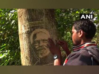 Odisha artist carves PM's portrait on trees urging him to take note of illegal tree cutting | Odisha artist carves PM's portrait on trees urging him to take note of illegal tree cutting Odisha artist carves PM's portrait on trees urging him to take note of illegal tree cutting | Odisha artist carves PM's portrait on trees urging him to take note of illegal tree cutting