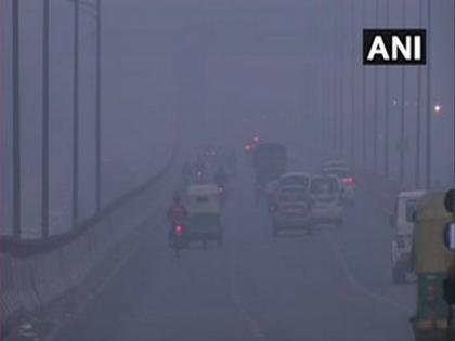 Delhi shivers at 3.3°C, fog engulfs parts of city | Delhi shivers at 3.3°C, fog engulfs parts of city Delhi shivers at 3.3°C, fog engulfs parts of city | Delhi shivers at 3.3°C, fog engulfs parts of city
