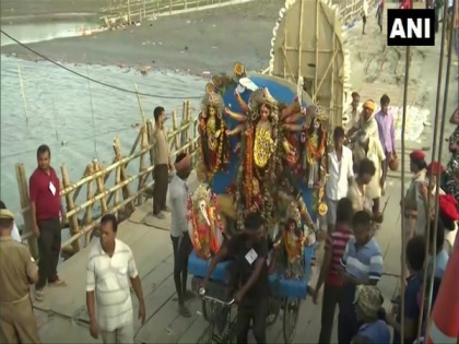 Assam: Devotees bid adieu to Goddess Durga on Vijay Dashami with 'Durga Visarjan' | Assam: Devotees bid adieu to Goddess Durga on Vijay Dashami with 'Durga Visarjan'