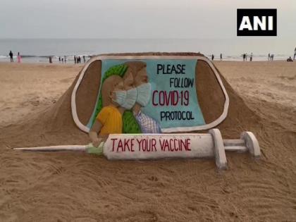 Odisha: Sudarsan Pattnaik creates sand art at Puri beach, appeals people to follow COVID protocols | Odisha: Sudarsan Pattnaik creates sand art at Puri beach, appeals people to follow COVID protocols