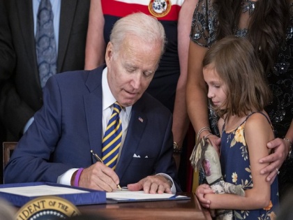 Biden signs Bill to expand health benefits for veterans exposed to toxic burn pits | Biden signs Bill to expand health benefits for veterans exposed to toxic burn pits