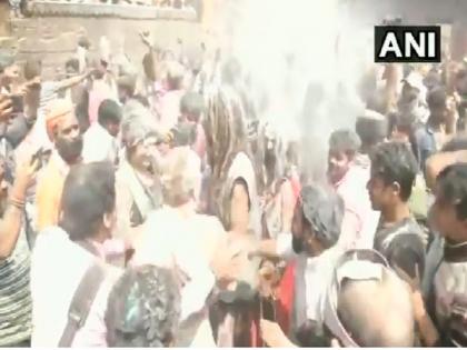 At Varanasi's Manikarnika Ghat, people celebrate Holi with pyre ash, gulal | At Varanasi's Manikarnika Ghat, people celebrate Holi with pyre ash, gulal At Varanasi's Manikarnika Ghat, people celebrate Holi with pyre ash, gulal | At Varanasi's Manikarnika Ghat, people celebrate Holi with pyre ash, gulal