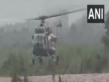 IAF helicopter rescues 7 people after they got stranded between two streams of Ujh river in J-K's Kathua | IAF helicopter rescues 7 people after they got stranded between two streams of Ujh river in J-K's Kathua