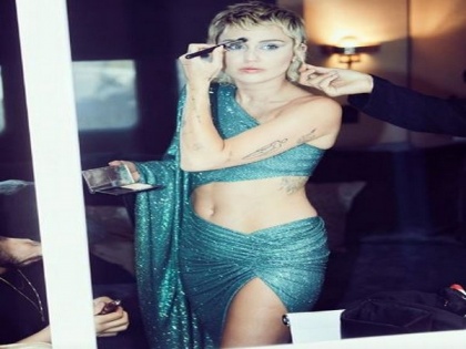 Miley Cyrus bares abs in Beatles-inspired dress for Global Citizen performance | Miley Cyrus bares abs in Beatles-inspired dress for Global Citizen performance