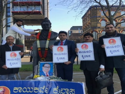 K'taka Min pays tribute to Basaveshwara statue in London | K'taka Min pays tribute to Basaveshwara statue in London