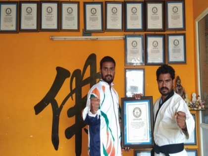 Blindfolded martial arts master from Andhra smashes 49 coconuts placed around student, creates Guinness World Record | Blindfolded martial arts master from Andhra smashes 49 coconuts placed around student, creates Guinness World Record