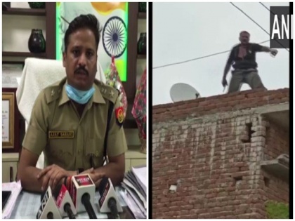 UP: Man held for shooting bank security guard, waves gun as he dances on rooftop in Meerut | UP: Man held for shooting bank security guard, waves gun as he dances on rooftop in Meerut