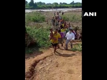 Odisha fire personnel rescue child trapped between two rocks in river | Odisha fire personnel rescue child trapped between two rocks in river