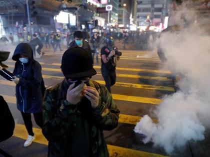 Hong Kong police resort to pepper spray, tear gas during Christmas protests | Hong Kong police resort to pepper spray, tear gas during Christmas protests