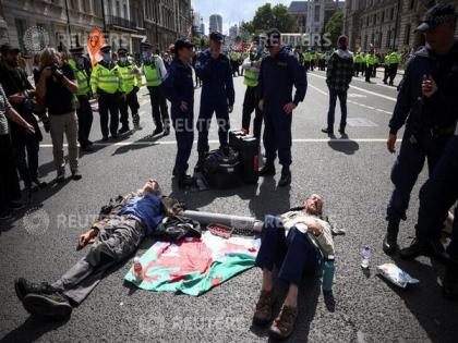 Insulate Britain climate protesters block roads around UK parliament | Insulate Britain climate protesters block roads around UK parliament