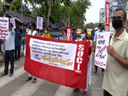 SUCI members protest against Centre, WB govt; demand proper arrangements for migrant workers | SUCI members protest against Centre, WB govt; demand proper arrangements for migrant workers