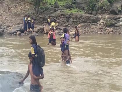 In absence of bridge on river, students have to swim to reach school in Maharashtra village | In absence of bridge on river, students have to swim to reach school in Maharashtra village