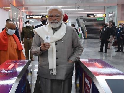 PM Modi buys ticket to ride Kanpur metro | PM Modi buys ticket to ride Kanpur metro
