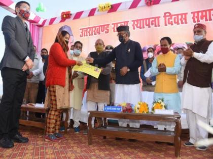 Uttarakhand CM distributes digital ration cards on state's formation day | Uttarakhand CM distributes digital ration cards on state's formation day