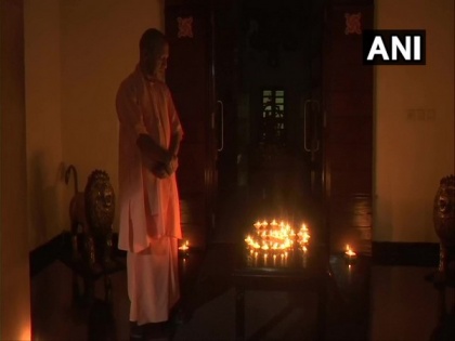 UP CM Yogi Adityanath lights earthen lamps to form Om | UP CM Yogi Adityanath lights earthen lamps to form Om
