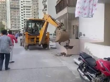 Illegal construction demolished in Noida housing society | Illegal construction demolished in Noida housing society