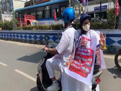 To protest fuel price hike, Mamata Banerjee takes electric scooter to office | To protest fuel price hike, Mamata Banerjee takes electric scooter to office