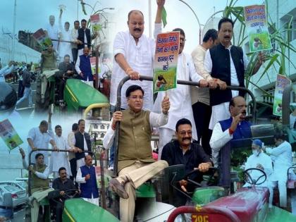 Congress MLAs arrive at Uttrakhand assembly on tractor with sugarcane to stage protest | Congress MLAs arrive at Uttrakhand assembly on tractor with sugarcane to stage protest