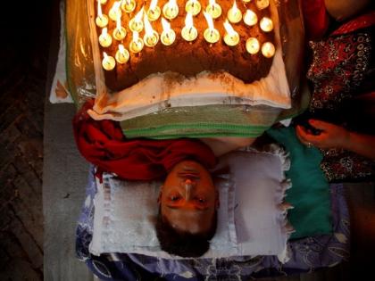 Devotees thank gods by covering body with cow dung, lit oil-lamps in Nepal | Devotees thank gods by covering body with cow dung, lit oil-lamps in Nepal Devotees thank gods by covering body with cow dung, lit oil-lamps in Nepal | Devotees thank gods by covering body with cow dung, lit oil-lamps in Nepal