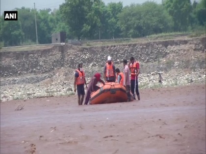 Woman gets stranded in river waters in Jammu, rescued by SDRF, police | Woman gets stranded in river waters in Jammu, rescued by SDRF, police