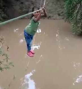 Students reaching school in MP dist by crossing river on ropes | Students reaching school in MP dist by crossing river on ropes