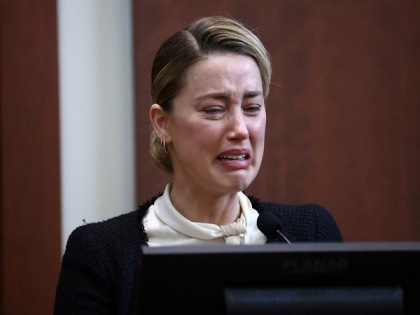 Amber Heard bursts into tears as she recounts sexual assault by Johnny Depp | Amber Heard bursts into tears as she recounts sexual assault by Johnny Depp