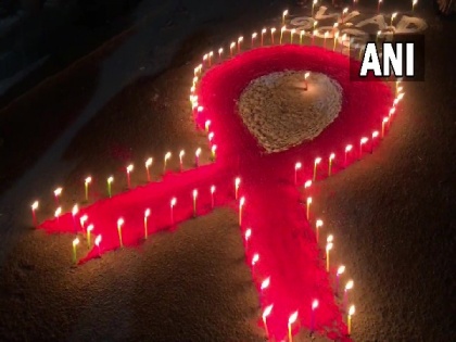 Siliguri: Sex workers, AIDS patients light up candles on eve of World AIDS Day | Siliguri: Sex workers, AIDS patients light up candles on eve of World AIDS Day
