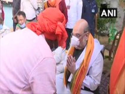 Amit Shah visits tribal family in West Bengal village | Amit Shah visits tribal family in West Bengal village