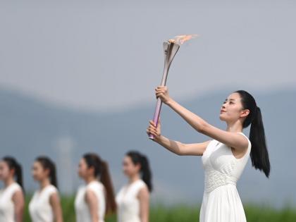 Flame for Hangzhou 2022 Asian Games lit in Liangzhu culture site | Flame for Hangzhou 2022 Asian Games lit in Liangzhu culture site
