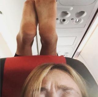 Passengers shocked at woman's bizarre stretch on mid-flight | Passengers shocked at woman's bizarre stretch on mid-flight