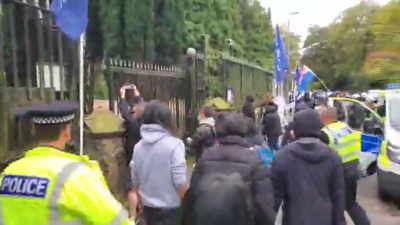 Manchester: Protester dragged into Chinese consulate grounds, beaten up | Manchester: Protester dragged into Chinese consulate grounds, beaten up