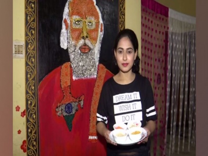 Odisha's artist crafts 8 ft long portrait of PM Modi using food grains on his birthday | Odisha's artist crafts 8 ft long portrait of PM Modi using food grains on his birthday