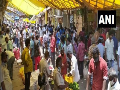 Large crowd gathers at flower market in Coimbatore amid lockdown | Large crowd gathers at flower market in Coimbatore amid lockdown