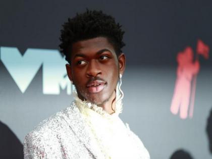 Lil Nas X says he's experiencing COVID-19 symptoms after dropping out of Jingle Ball show | Lil Nas X says he's experiencing COVID-19 symptoms after dropping out of Jingle Ball show