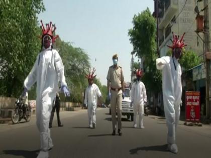 Delhi: Police creates awareness using COVID-19 themed helmets | Delhi: Police creates awareness using COVID-19 themed helmets