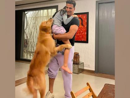 Akshay Kumar adorably hugs his daughter, pet dog in this picture | Akshay Kumar adorably hugs his daughter, pet dog in this picture Akshay Kumar adorably hugs his daughter, pet dog in this picture | Akshay Kumar adorably hugs his daughter, pet dog in this picture