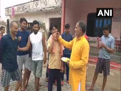 UP: Shivali villagers distribute sweets post Vikas Dubey's encounter, say 'finally we're free' | UP: Shivali villagers distribute sweets post Vikas Dubey's encounter, say 'finally we're free'
