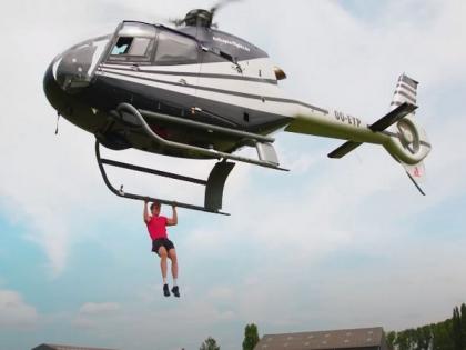 YouTubers smash Guinness World Record by doing 25 pull-ups from helicopter | YouTubers smash Guinness World Record by doing 25 pull-ups from helicopter